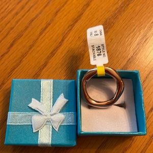 Woman’s stackable beveled rose gold plated ring size 8. NWT
